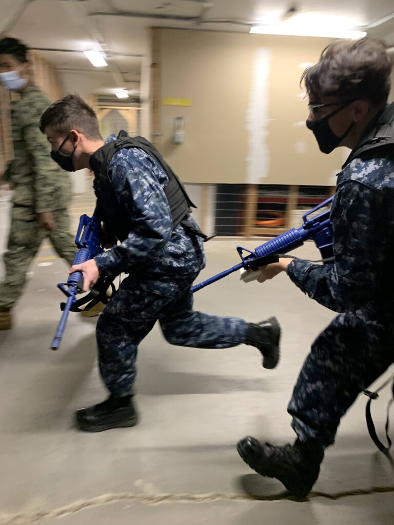 Cadets running to an emergency call with combat gear