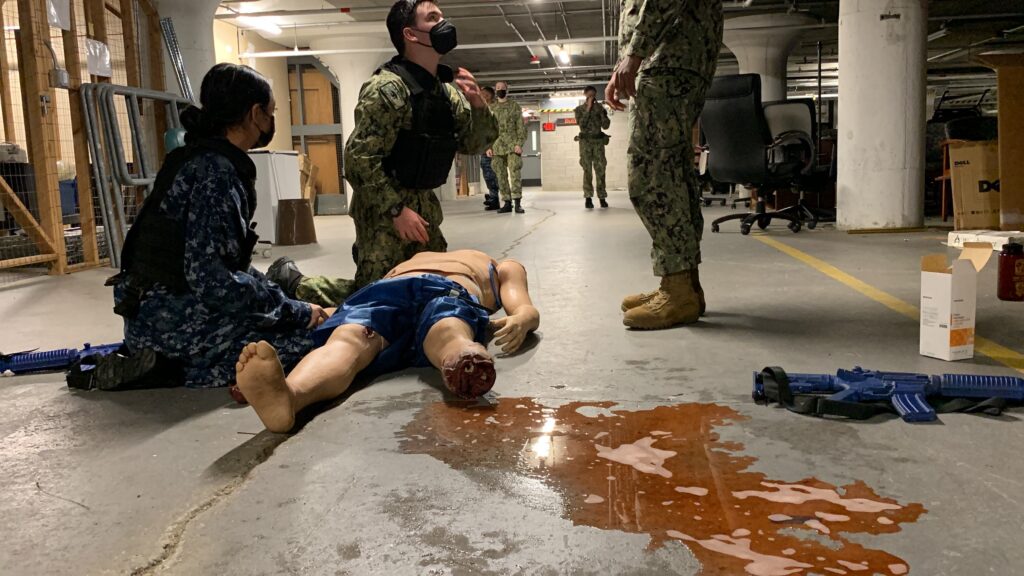 Cadet treating bleeding mannequin